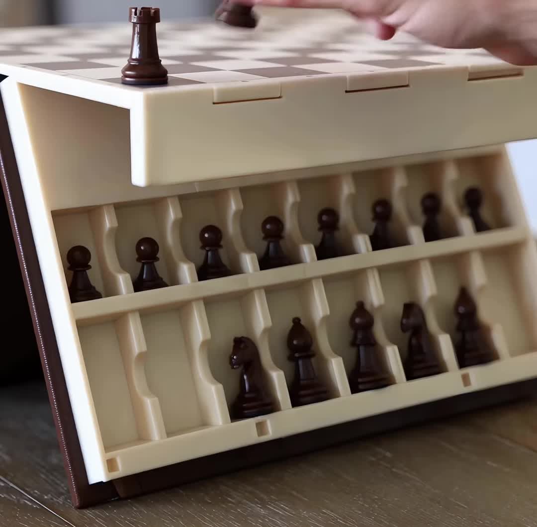 Magnetic pieces stored in their own slots inside the book