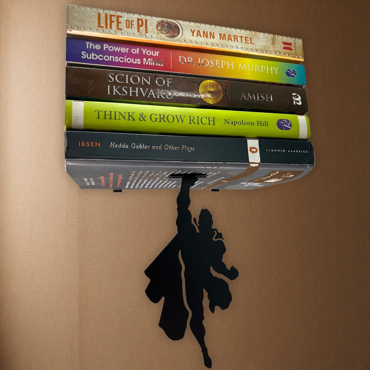 Vertical Hold superhero floating bookshelf on realistic brown wall