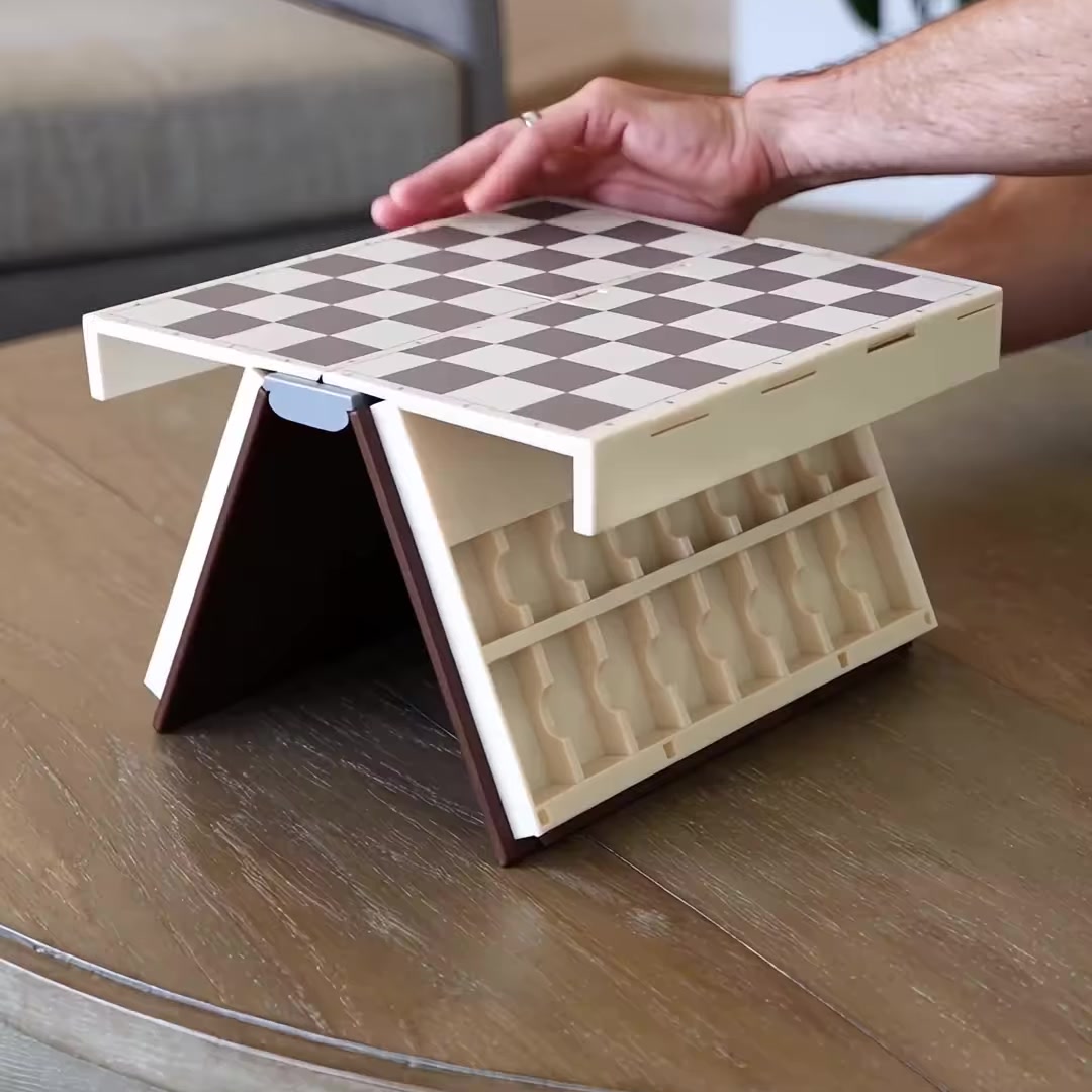 Open chess book standing as a raised board