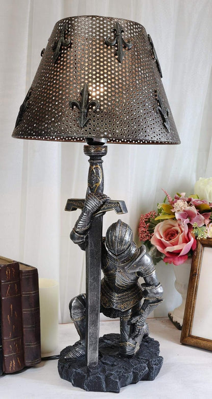 Kneeling knight table lamp beside books and flowers