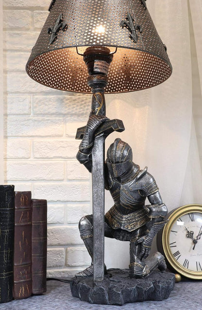 Kneeling knight table lamp glowing beside old books on a shelf