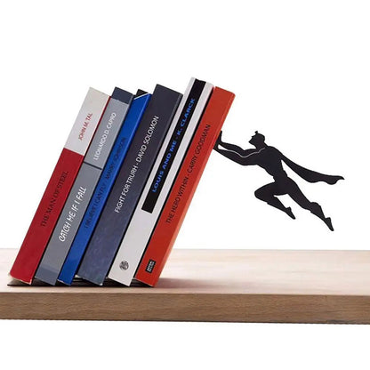 Leaning superhero floating bookshelf holding tilted books on desk