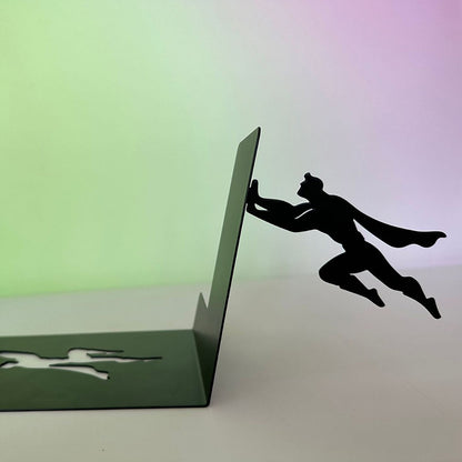 Leaning superhero floating bookshelf empty L-bracket with cape silhouette