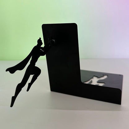 Leaning superhero floating bookshelf alternate angle of cape hero push pose