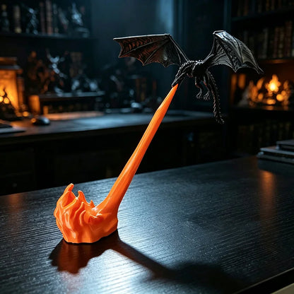 Black fire breathing dragon sculpture on an orange flame stream stand on a dark wood desk