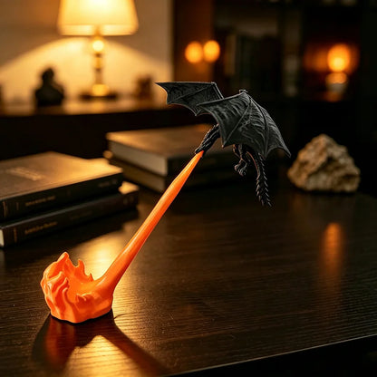 Fire breathing dragon desk decor beside books and a desk lamp