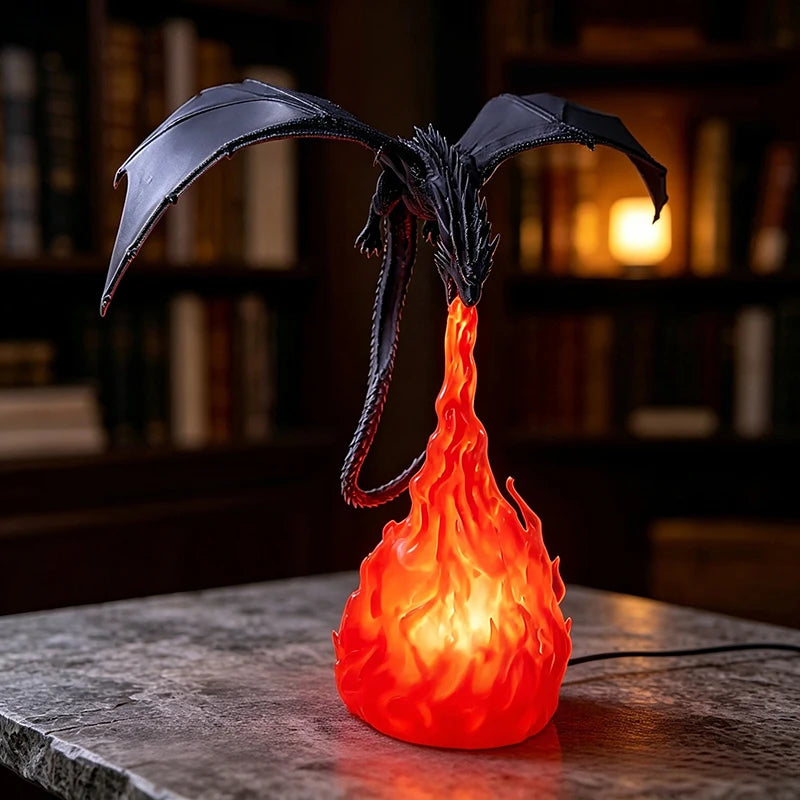 Glowing LED dragon lamp: black dragon breathing a lit red orange flame on a stone desk, power cord at the base