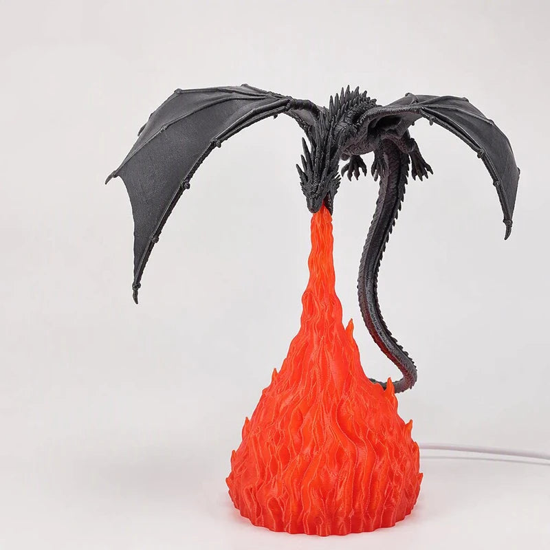 Glowing LED dragon lamp on a white background