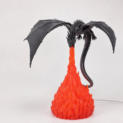 Glowing LED dragon lamp on a white background