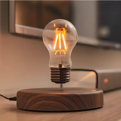 Floating filament bulb hovering over its round walnut look base on a desk
