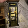 Graffiti phone booth lamp lit up on a bed, real photo