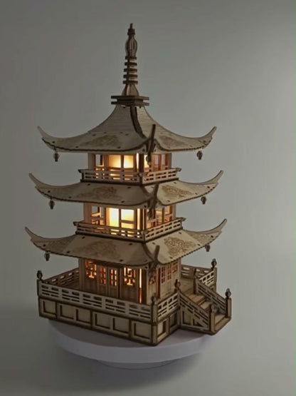 Finished wooden pagoda lamp lit up, angled view